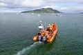 Orange inflatable lifeboat heading to sea Royalty Free Stock Photo