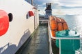 Orange inflatable lifeboats on ferry deck for emergencies and maritime accidents. Rescue boat, raft on the roof of a ferry.  Life Royalty Free Stock Photo