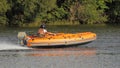 Outboard motor boat planing on water