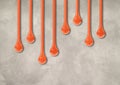 Orange ink drops on light concrete wall. Horizontal wallpaper