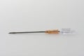 Orange intravenous cannula 14 G on white background, external diameter 2,1 mm, used in trauma, blood transfusion, surgery, ascites