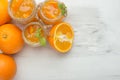 Orange jam in a glass jar on a light background. With an empty space for writing Royalty Free Stock Photo