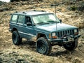 Orange Jeep Rock Crawling Royalty Free Stock Photo