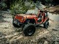 Orange Jeep Rock Crawling