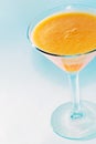 Orange jello in a martini glass