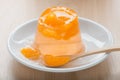 Orange jelly on white dish, selective focus