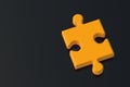 Orange jigsaw puzzle piece on a black background with mirror reflection. Copy space