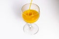 Orange juice is being poured into the glass. Drink Royalty Free Stock Photo