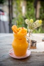Orange juice blended into a glass jar or Orange smoothie Decorated with orange Royalty Free Stock Photo