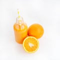 Orange juice in a bottle. White background. The concept of beverages, health food and diet. Royalty Free Stock Photo