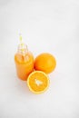 Orange juice in a bottle. White background. The concept of beverages, health food and diet. Royalty Free Stock Photo