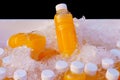 Orange juice bottles on ice box for healthy drink Royalty Free Stock Photo