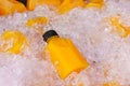 Orange juice bottles on ice box for healthy drink Royalty Free Stock Photo