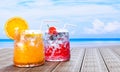 Orange juice in clear glass with ice cubes and Mocktail Strawberry Soda not mix alcohol. Fresh strawberries. Cold drinks placed on Royalty Free Stock Photo