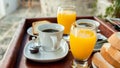 Orange juice and coffee as a part of a continental breakfast