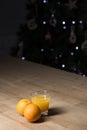 Orange juice on a drinking glass with fresh oranges fruit on a wooden table Royalty Free Stock Photo