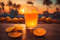 Orange juice in a glass on the background of the sea and palm trees Royalty Free Stock Photo