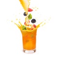 Orange juice in a glass with fruit: kiwi, hedgehog and strawberry isolated