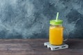 Orange juice in glass jar on dark background with copy space Royalty Free Stock Photo