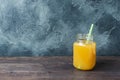 Orange juice in glass jar on dark background with copy space Royalty Free Stock Photo