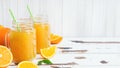 Orange juice in glass jars and fresh oranges on a white wooden rustic background Royalty Free Stock Photo