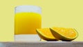 Orange juice in a glass with orange slices on a wooden tray on a bright yellow background. Natural fresh juice. Summer drink Royalty Free Stock Photo