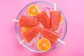 Orange juice healthy popsicles over ice cubes Royalty Free Stock Photo