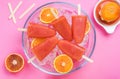 Orange juice healthy popsicles over ice cubes Royalty Free Stock Photo