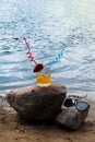 Orange juice with ice cubes and strawberries on the beach Royalty Free Stock Photo