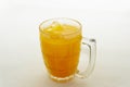 Orange juice ice in a glass on white background. Royalty Free Stock Photo