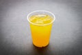 Orange juice ice in plastic cup Royalty Free Stock Photo