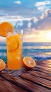 Orange juice with ice on wooden balcony by the sea Royalty Free Stock Photo