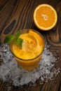 Orange juice with mint and ice rustic wooden table Royalty Free Stock Photo