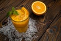 Orange juice with mint and ice rustic wooden table Royalty Free Stock Photo