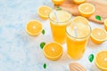 Fresh orange Juice and oranges on the cutting board Royalty Free Stock Photo