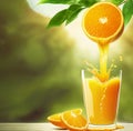 Orange juice is pouring from an orange hanging on a branch into a glass glass standing on a wooden table.