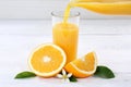 Orange juice pouring pour bottle oranges fruit fruits Royalty Free Stock Photo