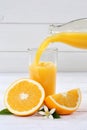 Orange juice pouring pour bottle portrait format oranges fruit f Royalty Free Stock Photo