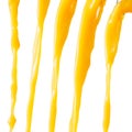 Orange juice is pouring. splash, pour, jet isolated on white Royalty Free Stock Photo