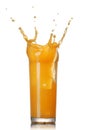 Orange juice splash in the glass isolated on white Royalty Free Stock Photo