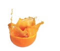 Orange juice splash inside an half orange