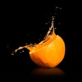 Orange juice splashing Royalty Free Stock Photo