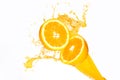 Orange juice splashing on half oranges Royalty Free Stock Photo