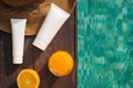 Orange juice, straw hat, sunblock and sunglasses by poolside Royalty Free Stock Photo