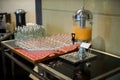 Orange juice in water cooler for breakfast at the hotel. Fresh orange juice from tank in buffet line. Royalty Free Stock Photo