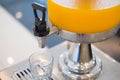 Orange juice in water cooler Royalty Free Stock Photo