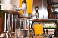 Orange juice and water in water cooler Royalty Free Stock Photo