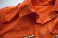 An orange jumpsuit of a prisoner. Serving of compulsory execution of court decisions