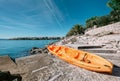 Orange kayak is on the sea pier, Adriatic seaside od Croatia