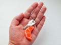 Orange keychain in women hand